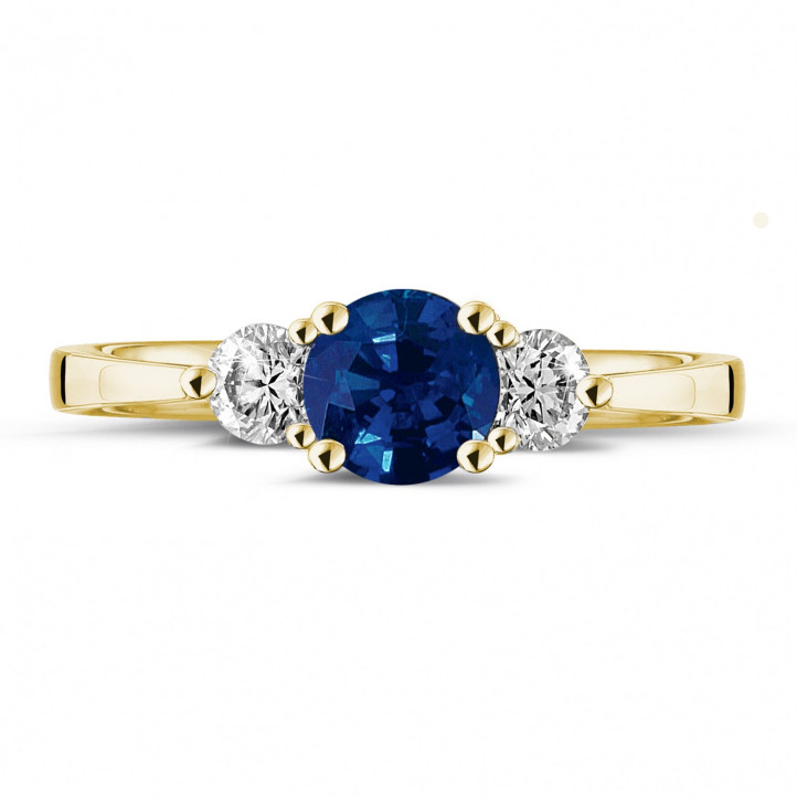 Trilogie Ring aus Gelbgold mit zentralem Saphir und 2 runde Diamanten