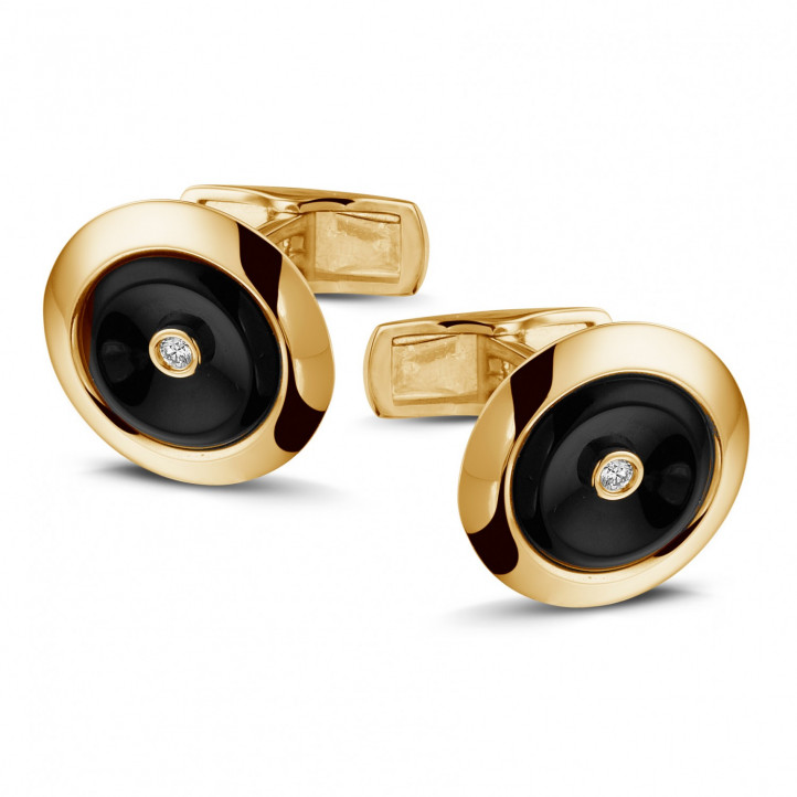 Manschettenknöpfe aus Gelbgold mit Onyx und zentralem Diamanten