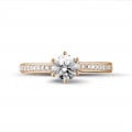 0.70 Karat Diamant Solitärring aus Rotgold mit kleinen Diamanten