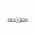 0.50 carat solitaire ring (half set) in white gold with side diamonds