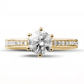 1.00 carat solitaire diamond ring in yellow gold with side diamonds