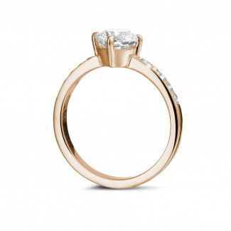 Engagement - 1.00 carat solitaire diamond ring in red gold with side diamonds