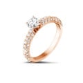 0.70 carat solitaire ring (half set) in red gold with side diamonds