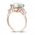 Ring in red gold with pear shaped diamond and taper cut baguette diamonds