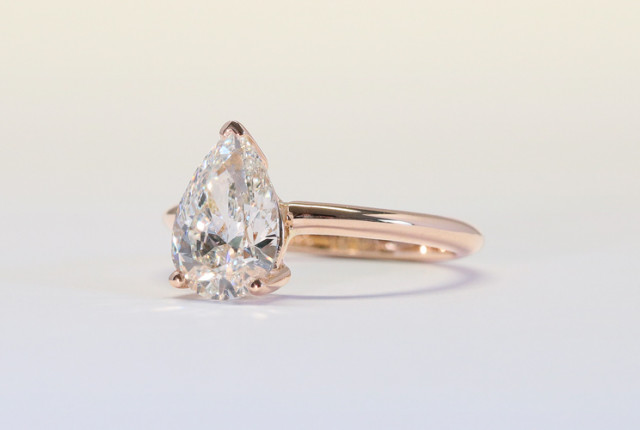 Rose gold engagement ring with a pear-shaped diamond in a four-prong setting A pear cut diamond is perfect for an engagement ring.