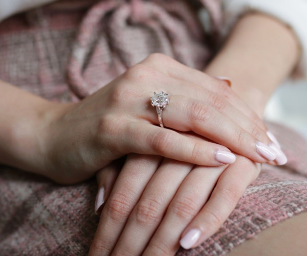 a solitaire engagement ring with a diamond