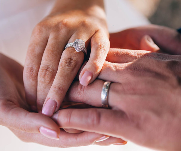 both partners confidently wearing engagement rings as a symbol of mutual love and commitment