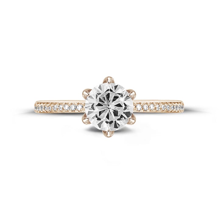 0.90 carat solitaire ring in red gold with side diamonds