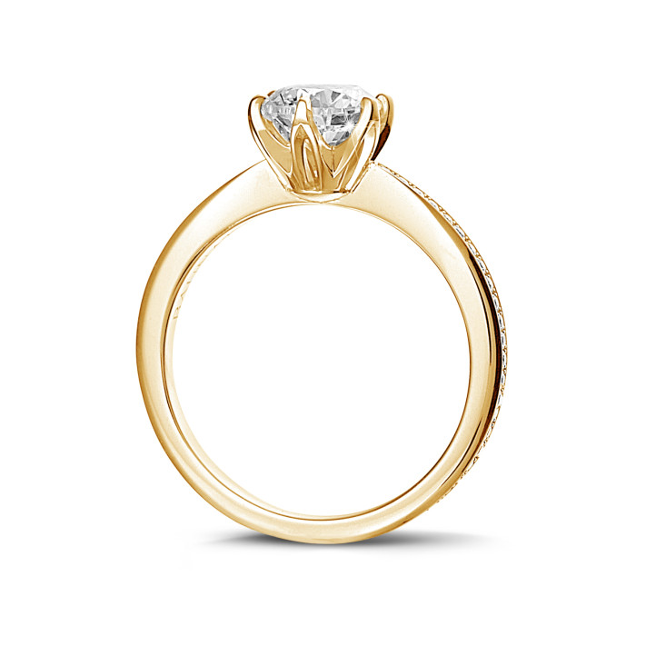 0.70 carat solitaire ring in yellow gold with side diamonds