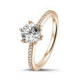 1.50 carat solitaire ring in red gold with side diamonds