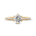 1.50 carat solitaire ring in yellow gold with side diamonds