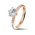 2.50 carat solitaire ring in red gold with side diamonds