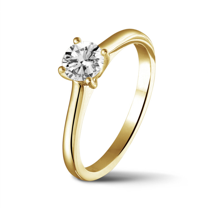 0.70 carat solitaire ring in yellow gold with round diamond and four prongs