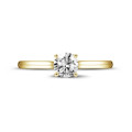 0.70 carat solitaire ring in yellow gold with round diamond and four prongs