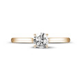 0.70 carat solitaire ring in red gold with round diamond and four prongs