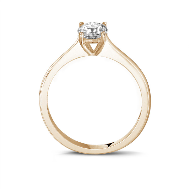 0.70 carat solitaire ring in red gold with round diamond and four prongs