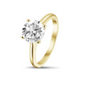 2.50 carat solitaire ring in yellow gold with round diamond and four prongs