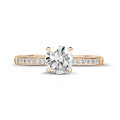 0.90 carat solitaire ring in red gold with four prongs and side diamonds