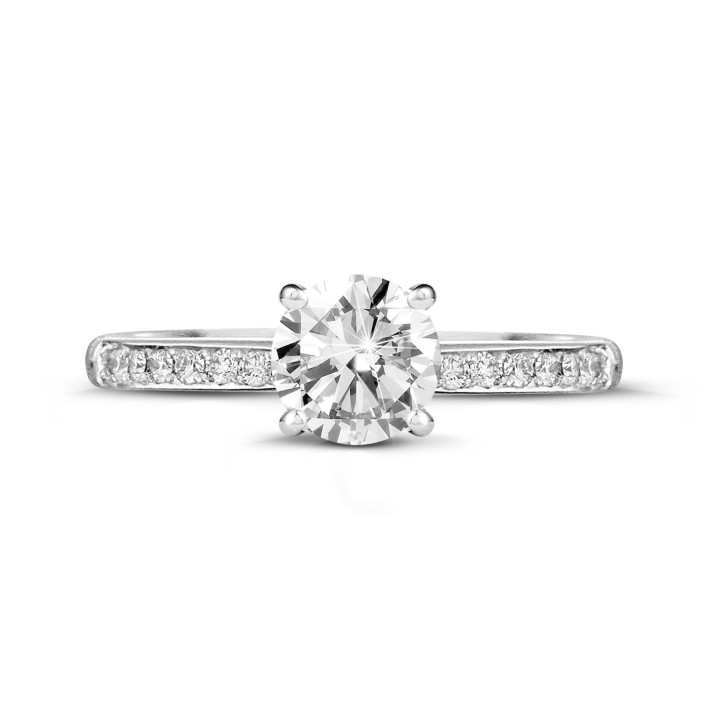 0.90 carat solitaire ring in white gold with four prongs and side diamonds