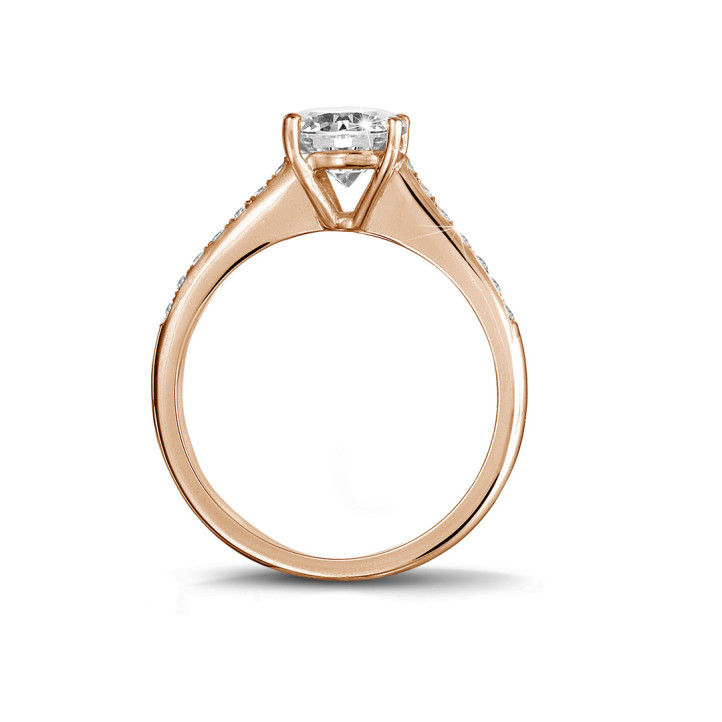 1.00 carat solitaire ring in red gold with four prongs and side diamonds