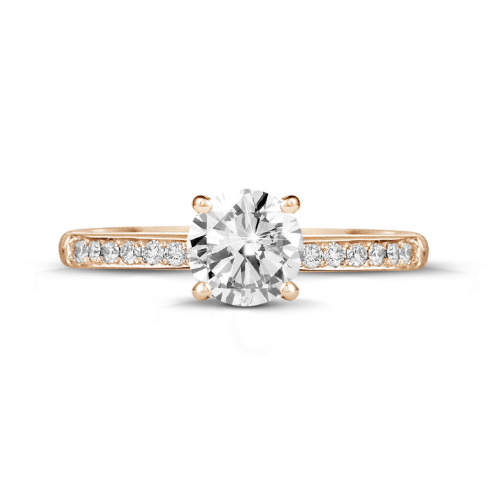 1.00 carat solitaire ring in red gold with four prongs and side diamonds