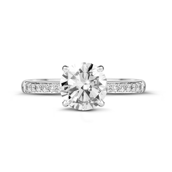 1.25 carat solitaire ring in white gold with four prongs and side diamonds