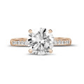 2.00 carat solitaire ring in red gold with four prongs and side diamonds