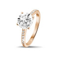 2.50 carat solitaire ring in red gold with four prongs and side diamonds
