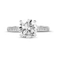 2.50 carat solitaire ring in white gold with four prongs and side diamonds