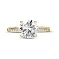 3.00 carat solitaire ring in yellow gold with four prongs and side diamonds