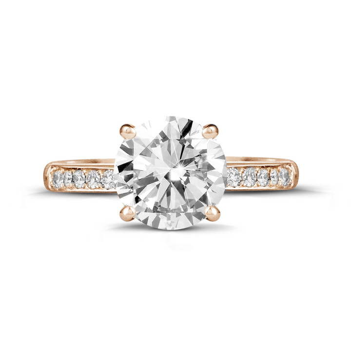 3.00 carat solitaire ring in red gold with four prongs and side diamonds