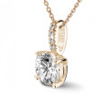 0.70 carat solitaire pendant in red gold with four prongs and round diamonds