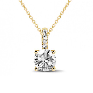 Necklaces - 1.00 carat solitaire pendant in yellow gold with four prongs and round diamonds