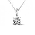 1.50 carat solitaire pendant in platinum with four prongs and round diamonds