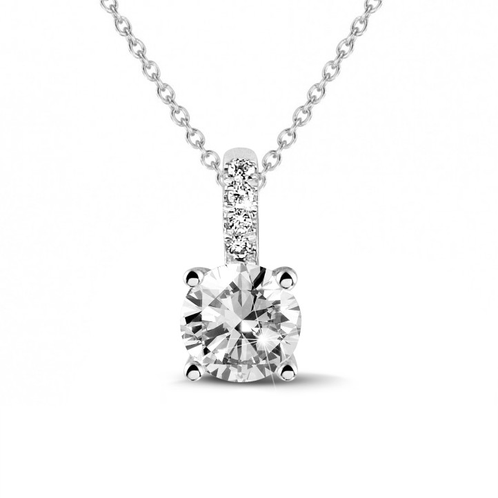 1.50 carat solitaire pendant in white gold with four prongs and round diamonds