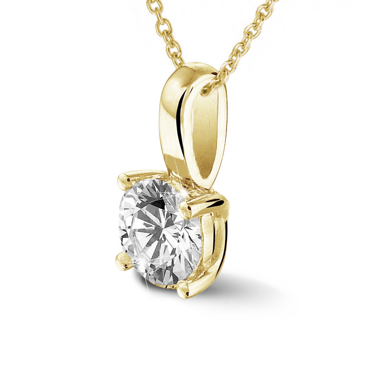 0.70 carat solitaire pendant in yellow gold with round diamond and four prongs