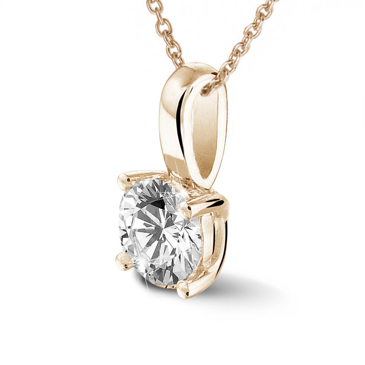 0.70 carat solitaire pendant in red gold with round diamond and four prongs