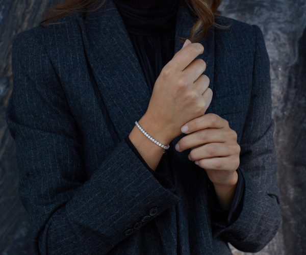 woman showcasing a perfectly fitting silver bracelet