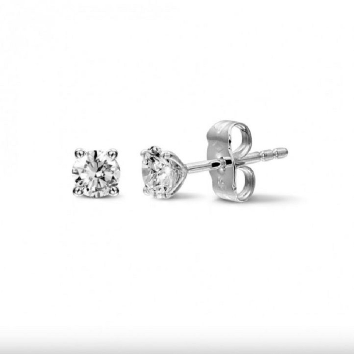 Mrs. Moulder 1.30 carat classic diamond earrings in white gold with four prongs and alpha locks