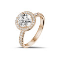 2.00 carat solitaire halo ring in red gold with round diamonds