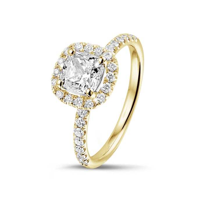 0.70 carat solitaire halo ring with a cushion diamond in yellow gold with round diamonds