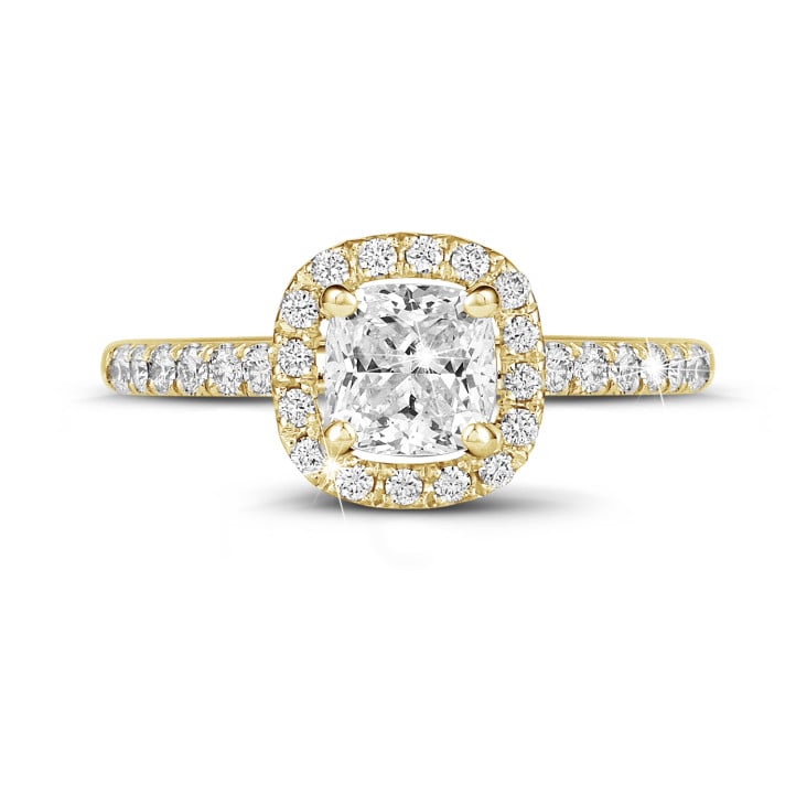 0.70 carat solitaire halo ring with a cushion diamond in yellow gold with round diamonds