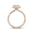0.70 carat solitaire halo ring with a cushion diamond in red gold with round diamonds