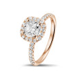 1.00 carat solitaire halo ring with a cushion diamond in red gold with round diamonds