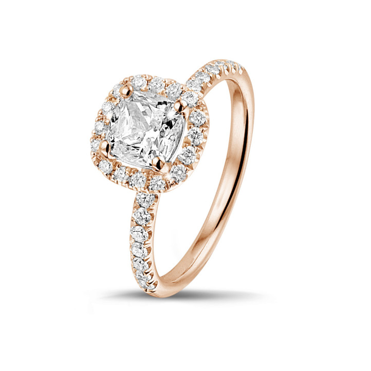 1.20 carat solitaire halo ring with a cushion diamond in red gold with round diamonds