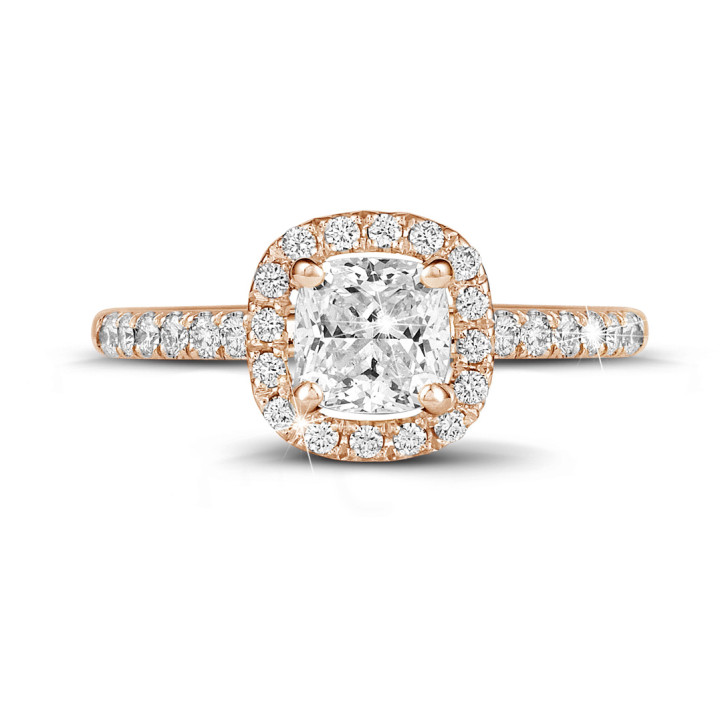 1.20 carat solitaire halo ring with a cushion diamond in red gold with round diamonds