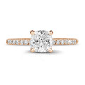 2.00 carat solitaire ring with a cushion diamond in red gold with side diamonds
