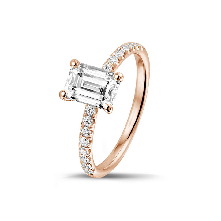 0.70 carat solitaire ring with an emerald cut diamond in red gold with side diamonds