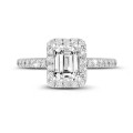 0.70 carat solitaire halo ring with an emerald cut diamond in white gold with round diamonds
