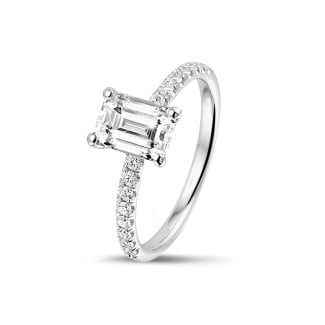Engagement - 1.00 carat solitaire ring with an emerald cut diamond in white gold with side diamonds